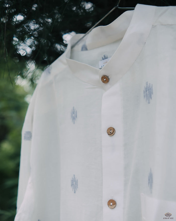 Men’s cotton shirt with Jamdani weaving, featuring traditional motifs and a relaxed silhouette.