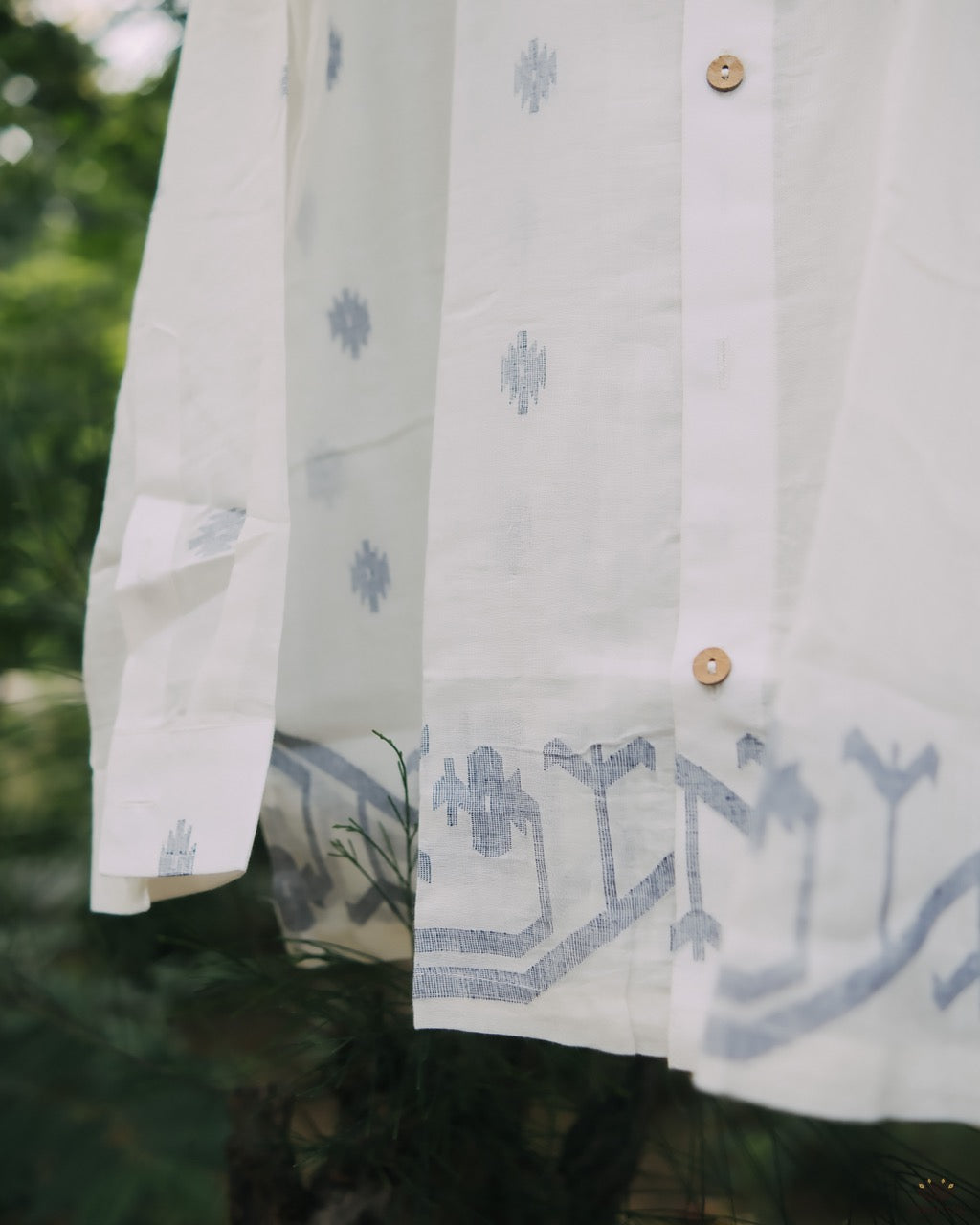 Men’s cotton shirt with Jamdani weaving, featuring traditional motifs and a relaxed silhouette.