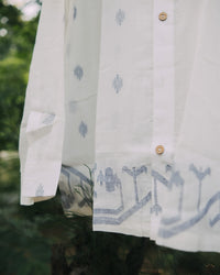 Men’s cotton shirt with Jamdani weaving, featuring traditional motifs and a relaxed silhouette.