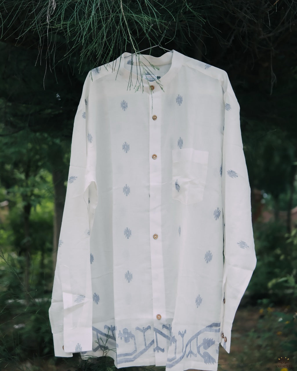 Men’s cotton shirt with Jamdani weaving, featuring traditional motifs and a relaxed silhouette.