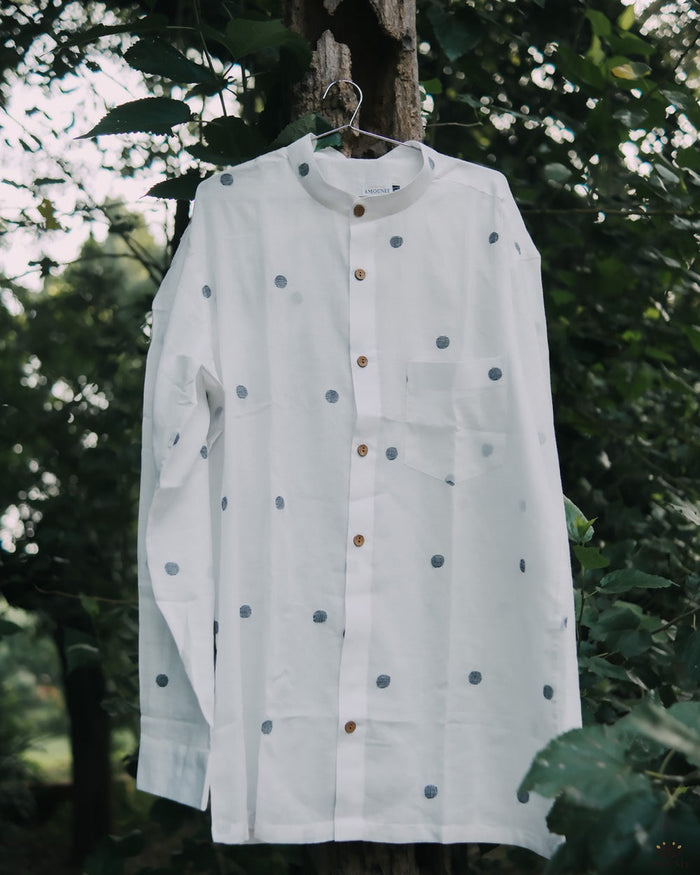 Men’s cotton shirt with Jamdani weaving, featuring traditional motifs and a relaxed silhouette.