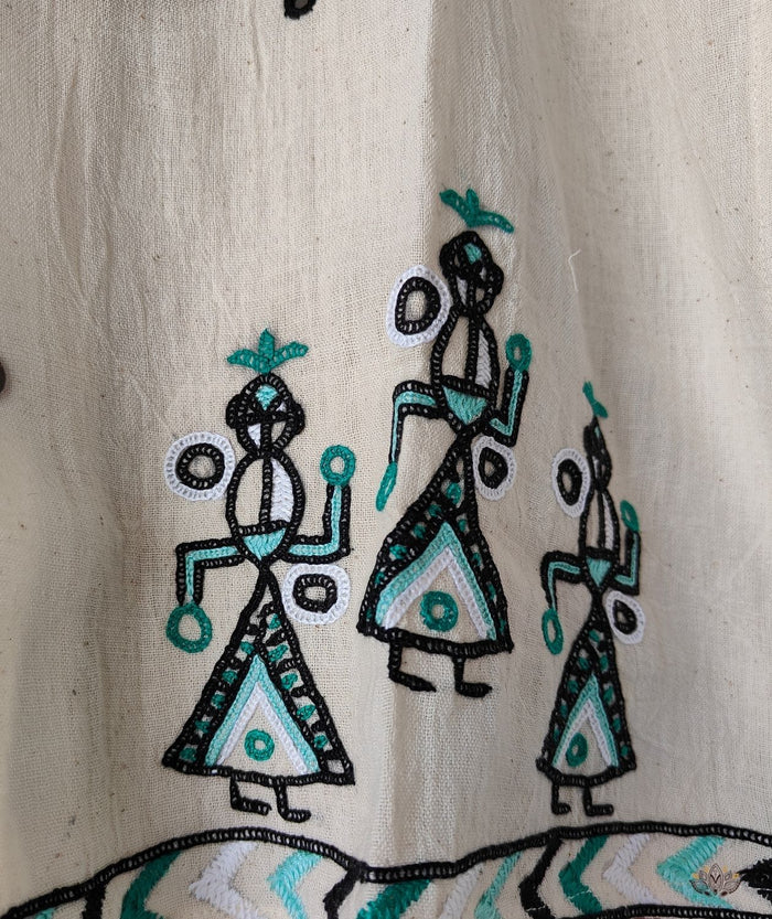 Embroidered design of people on a beige fabric 