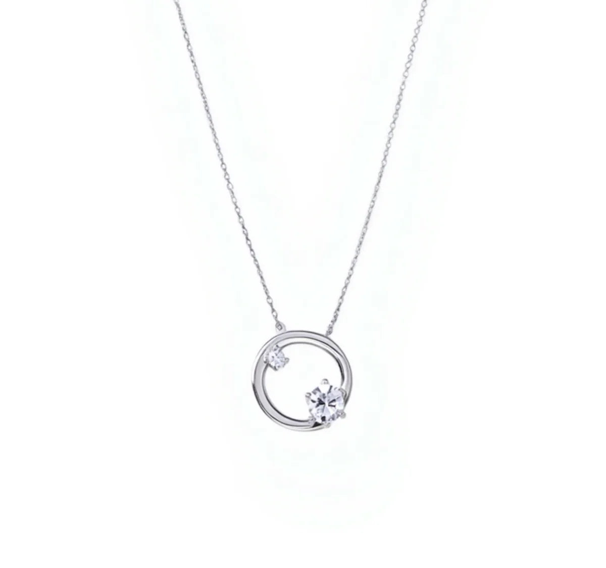 Astra Arc Necklace — close-up of silver wave pendant with crystal on fine chain, handcrafted ethical jewelry