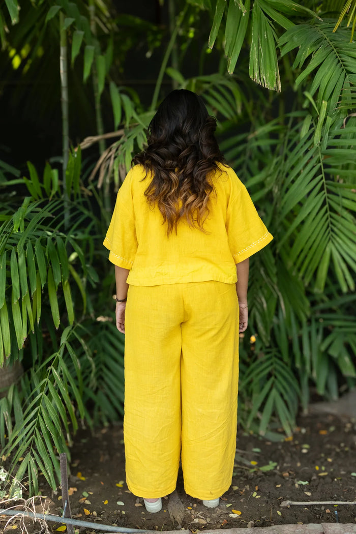 Aurina Shirt back view showing handwoven fabric texture and sleeveless silhouette