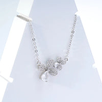Bloom Duo Necklace — artisan recycled silver necklace with double floral charm, sustainable ethical jewelry India