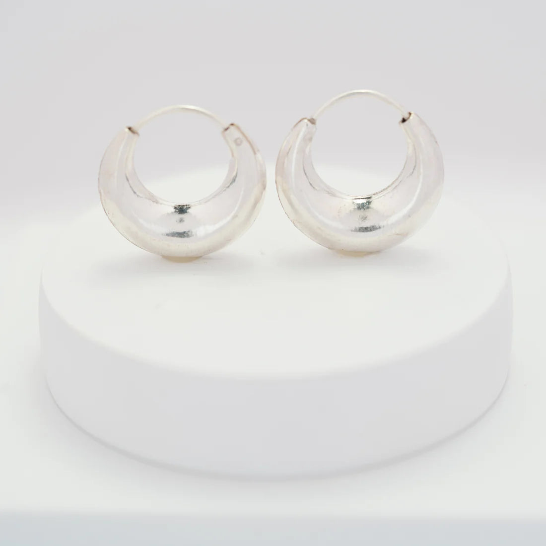 Chunky Bag Hoops — close-up of bold silver chunky hoop earrings with presence, ethical jewelry Mitti Lifestyle