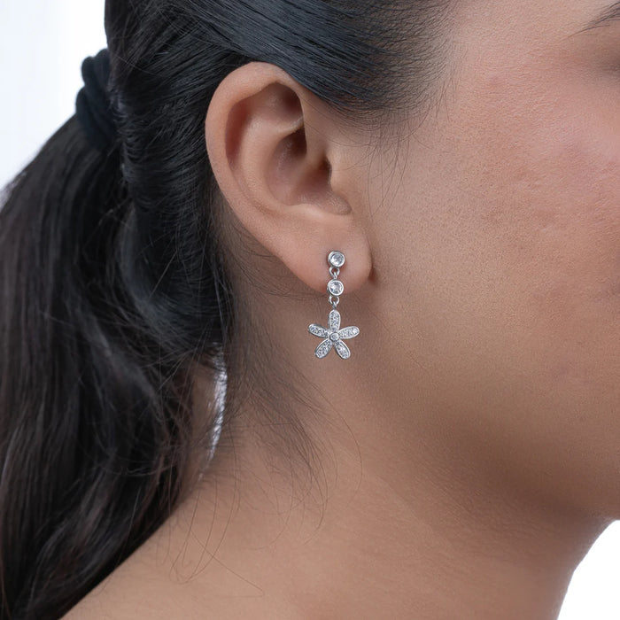 Floral Emblem Danglers — artisan silver signature floral motif danglers, side view ethical jewelry India