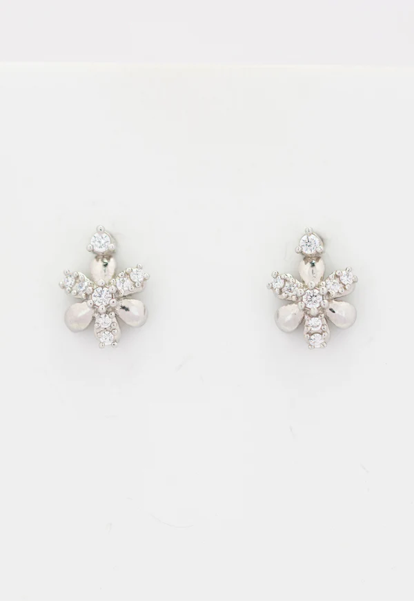 Floral Charm Studs — close-up of delicate silver flower stud earrings, handcrafted artisan jewelry India