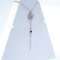 Falling Petals Necklace — close-up of silver petal pendant on fine chain, handcrafted ethical jewelry India