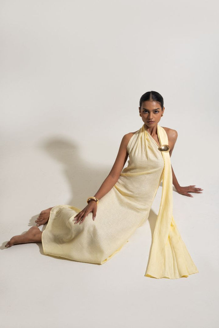 Woman wearing a flowing yellow dress 