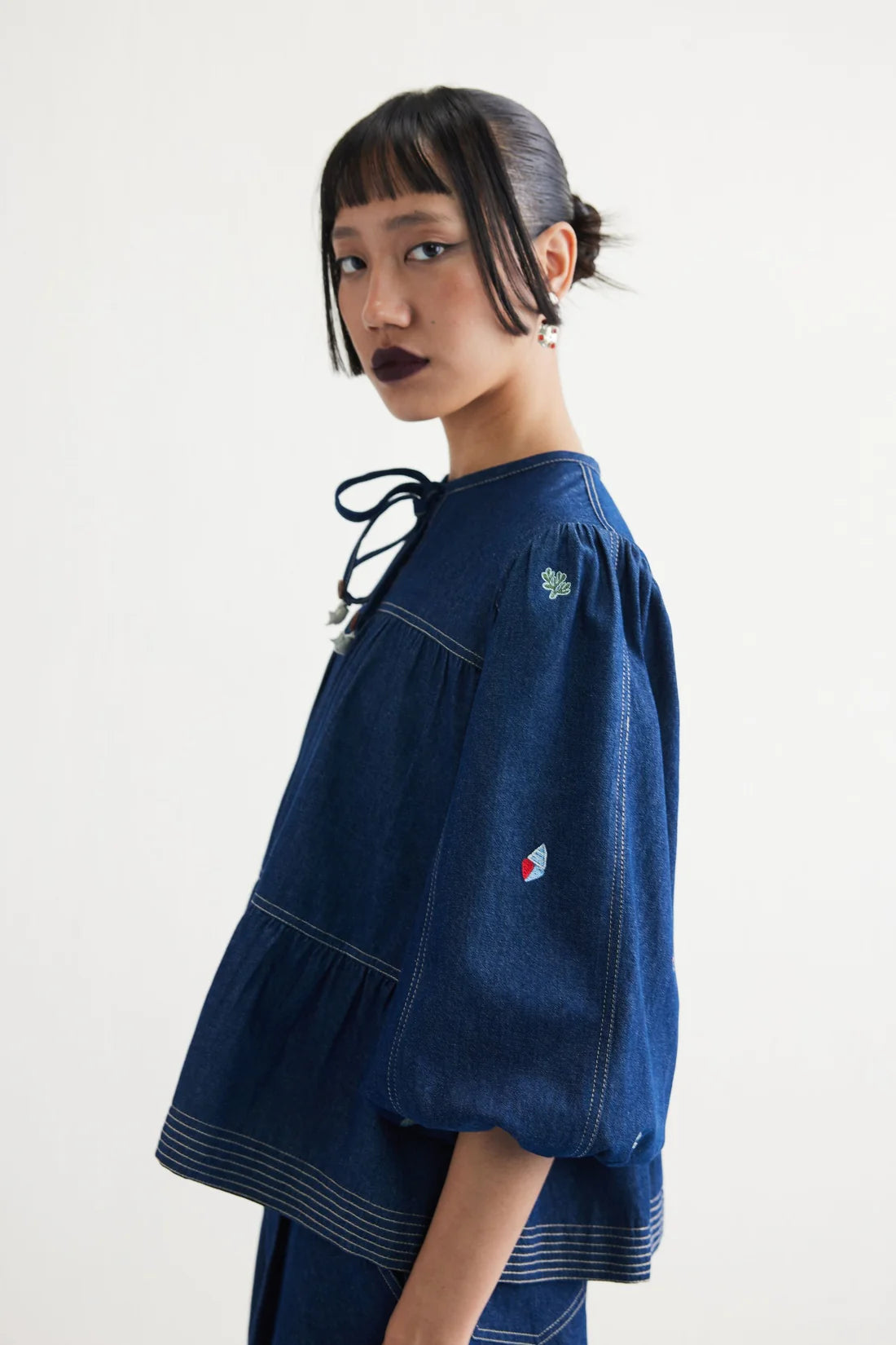 Deep Sea sustainable denim peplum top detail women's India artisan conscious