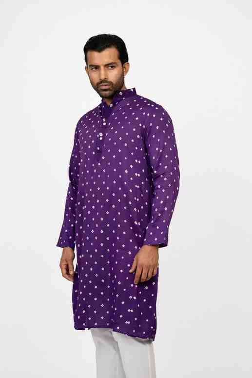 Man wearing a purple bandhej kurta 