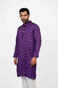 Man wearing a purple bandhej kurta 