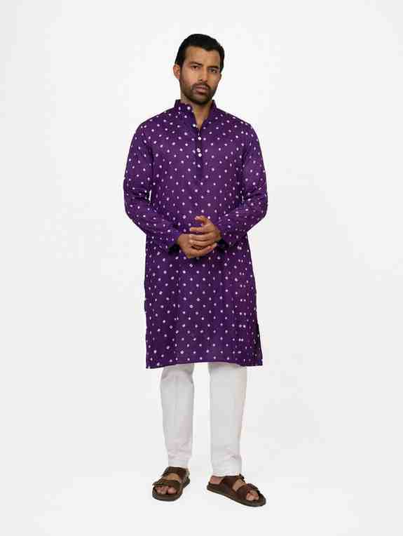 Man wearing a purple bandhej kurta 