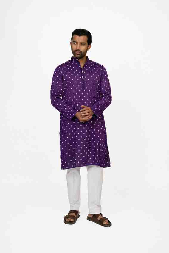 Man wearing a purple bandhej kurta 