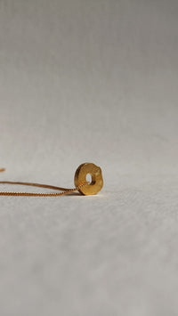 Gorria charm side view De'anma brass pendant handcrafted artisan India jewellery