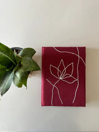 wildflower in red diary