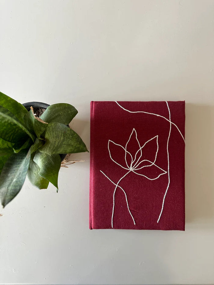 wildflower in red diary