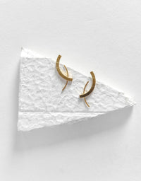 Taai studs worn model De'anma brass earrings handcrafted artisan India