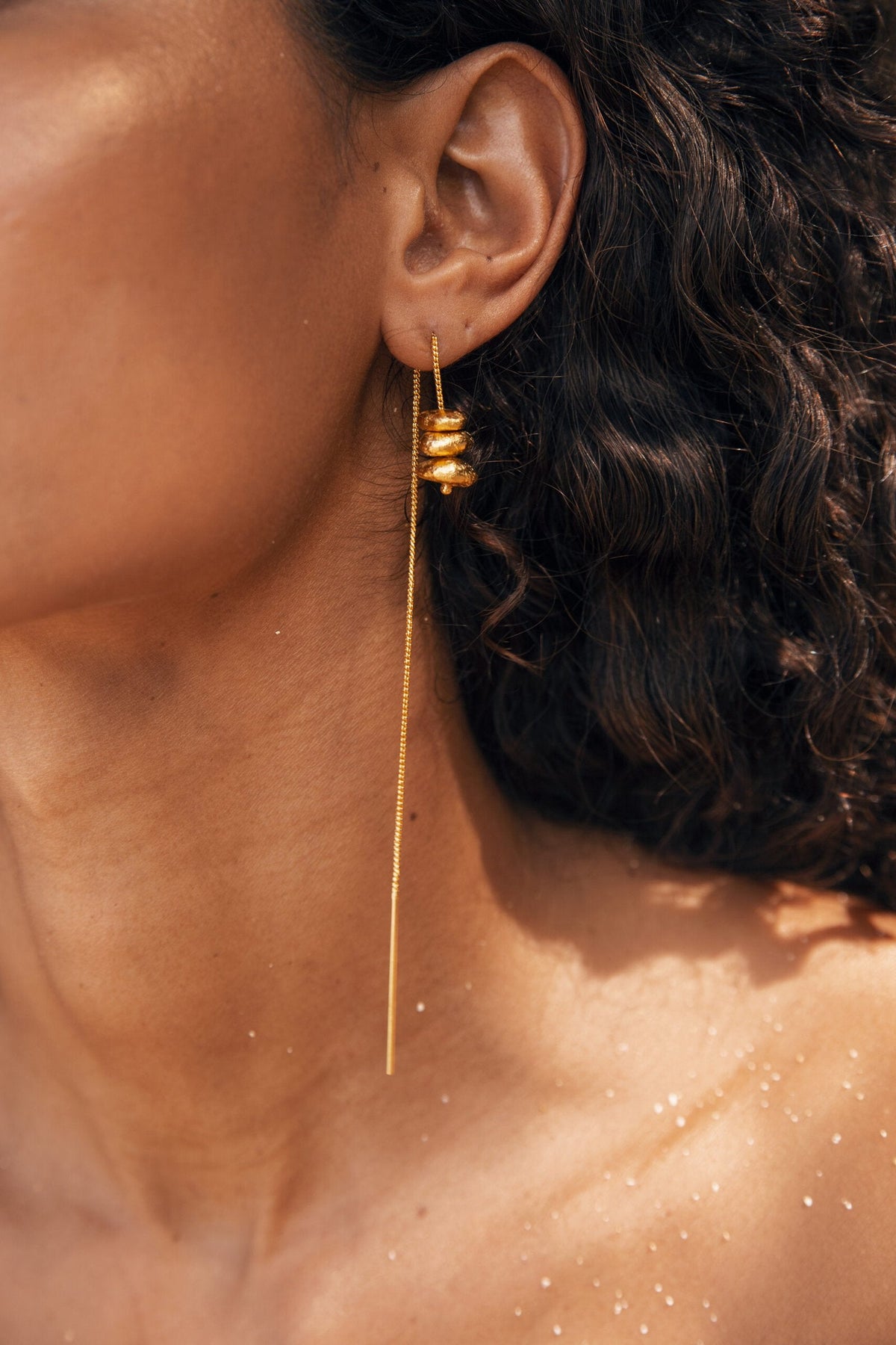Tiva De'anma brass earrings worn model artisan handcrafted India sustainable