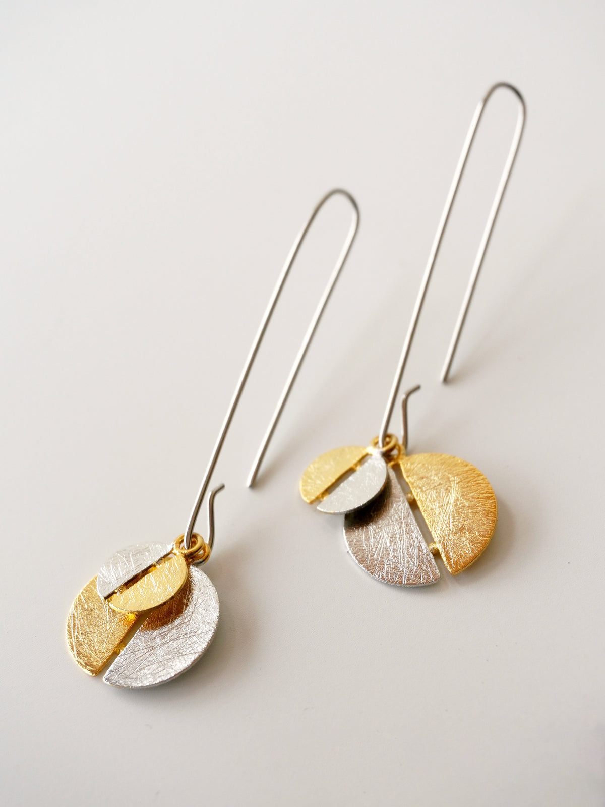 Alto Yin Yang De'anma brass earrings close-up detail handcrafted artisan India