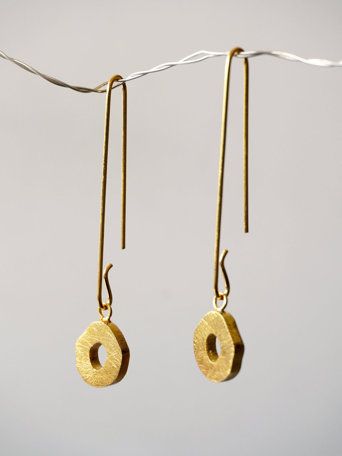 Alto Gorria front view De'anma brass earrings handcrafted artisan jewellery India