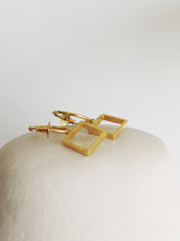 Oura Square XS De'anma brass geometric earrings worn model artisan India
