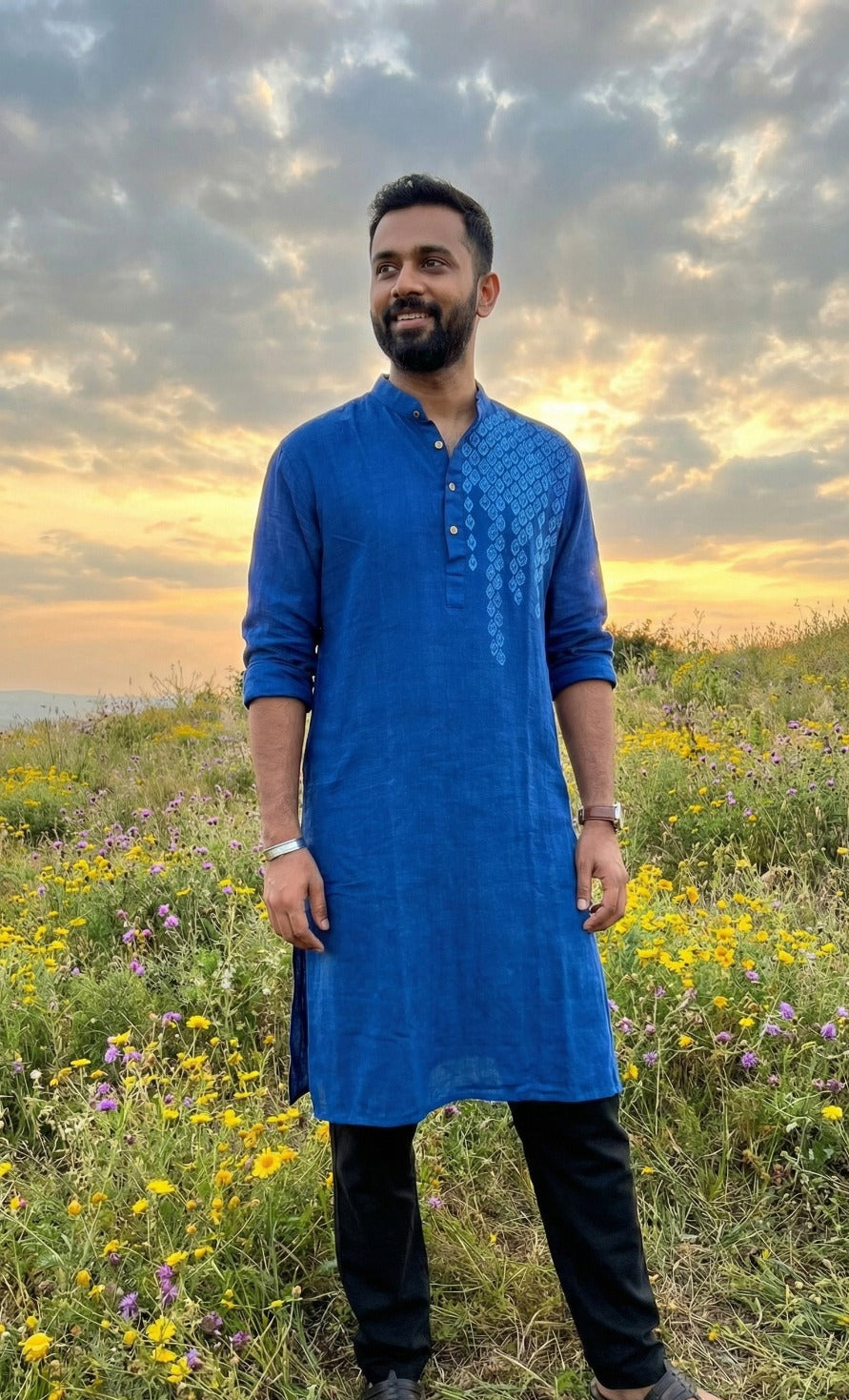Man wearing a khadi cotton kurta with a relaxed fit and natural textured fabric.