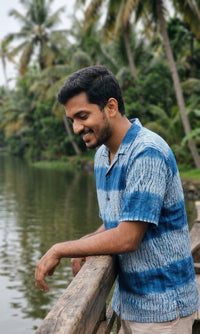 Handwoven kala cotton shirt designed with Shibori dyeing, offering unique patterns and an airy, comfortable feel.