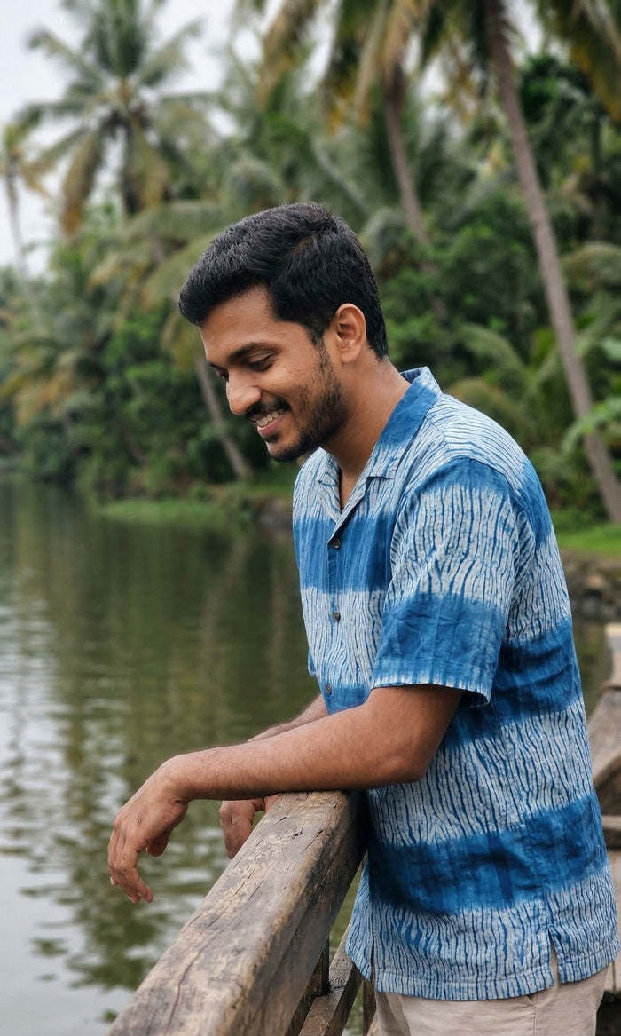 Handwoven kala cotton shirt designed with Shibori dyeing, offering unique patterns and an airy, comfortable feel.