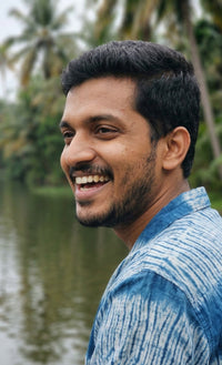 Handwoven kala cotton shirt designed with Shibori dyeing, offering unique patterns and an airy, comfortable feel.