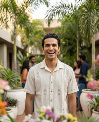 Handwoven kala cotton shirt in an off-white tone, detailed with intricate Jamdani motifs and a soft, airy finish.
