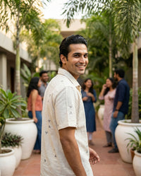 Handwoven kala cotton shirt in an off-white tone, detailed with intricate Jamdani motifs and a soft, airy finish.