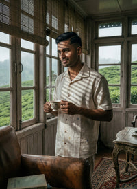 Off-white kala cotton shirt with delicate Jamdani weaving, showcasing fine textured motifs in a lightweight, breathable fabric.