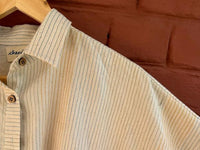 Close-up of a beige striped shirt 