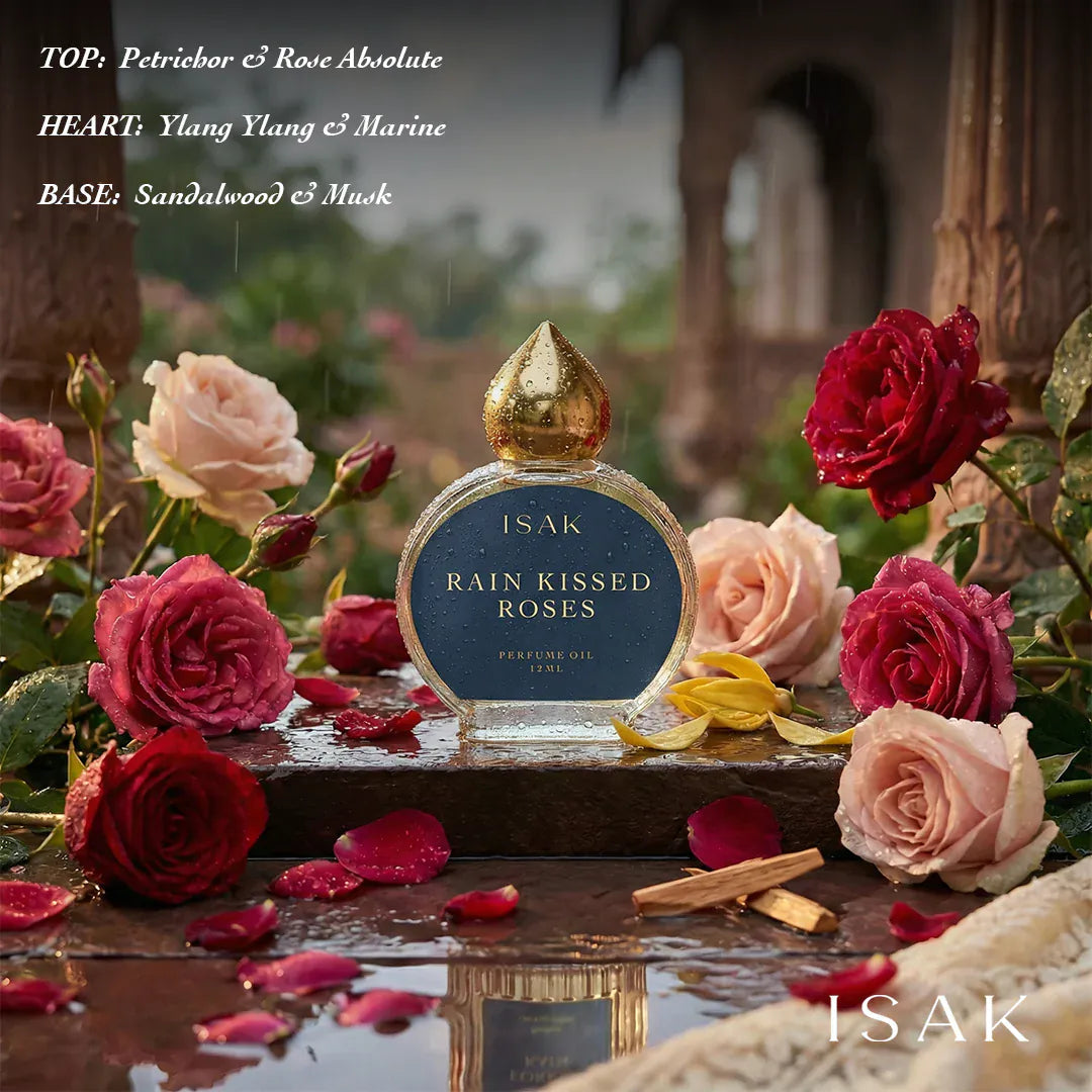 ISAK Rain Kissed Roses perfume oil bottle surrounded by roses
