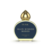 Perfume oil bottle labeled 'Rain Kissed Roses' by ISAK 