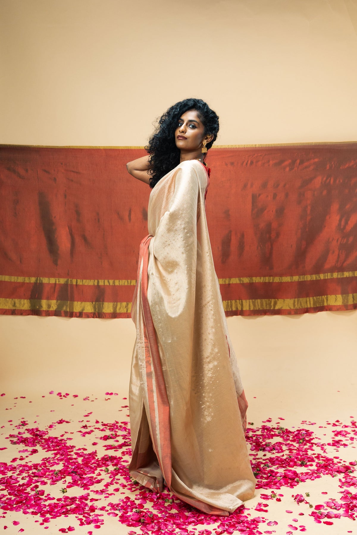 A luxurious rose gold handwoven tissue saree