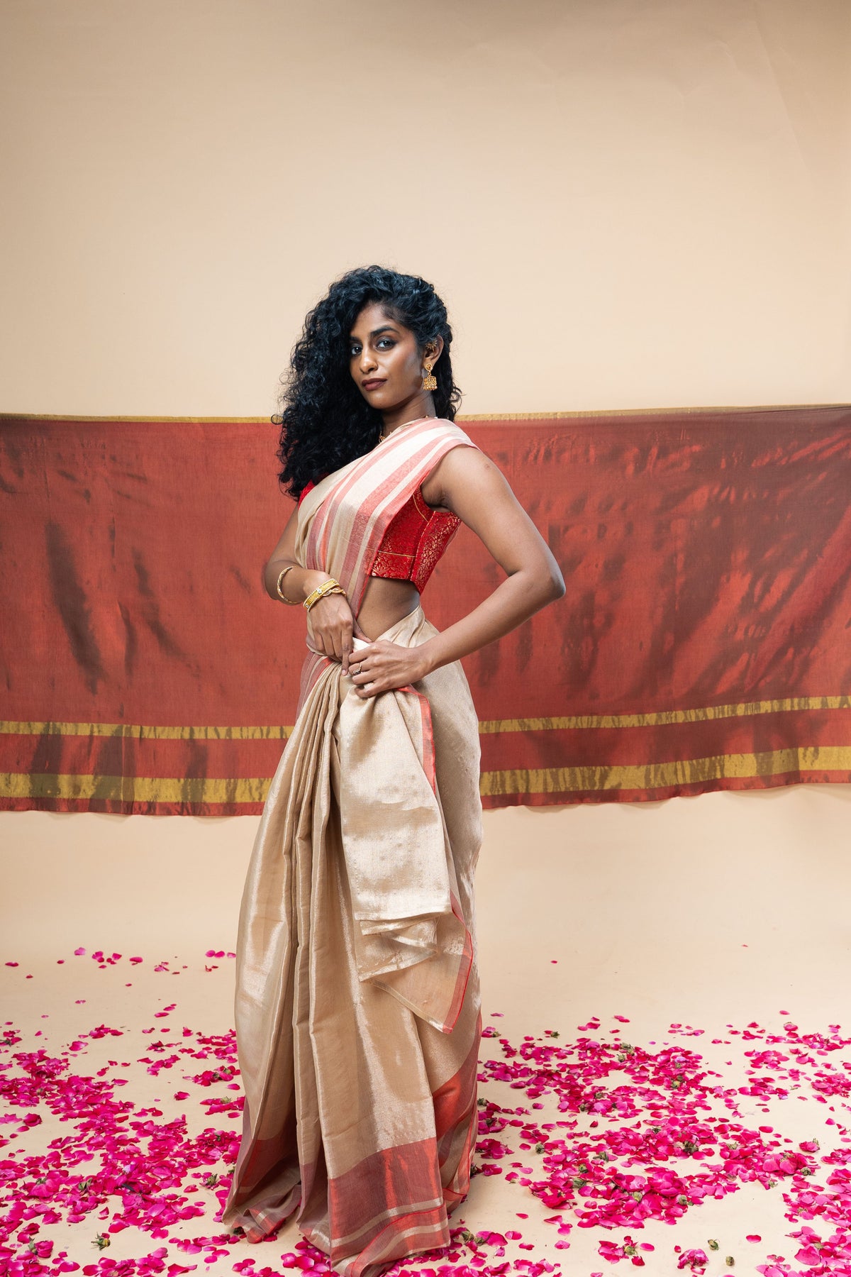 A luxurious rose gold handwoven tissue saree