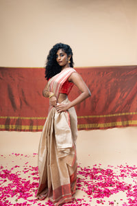 A luxurious rose gold handwoven tissue saree
