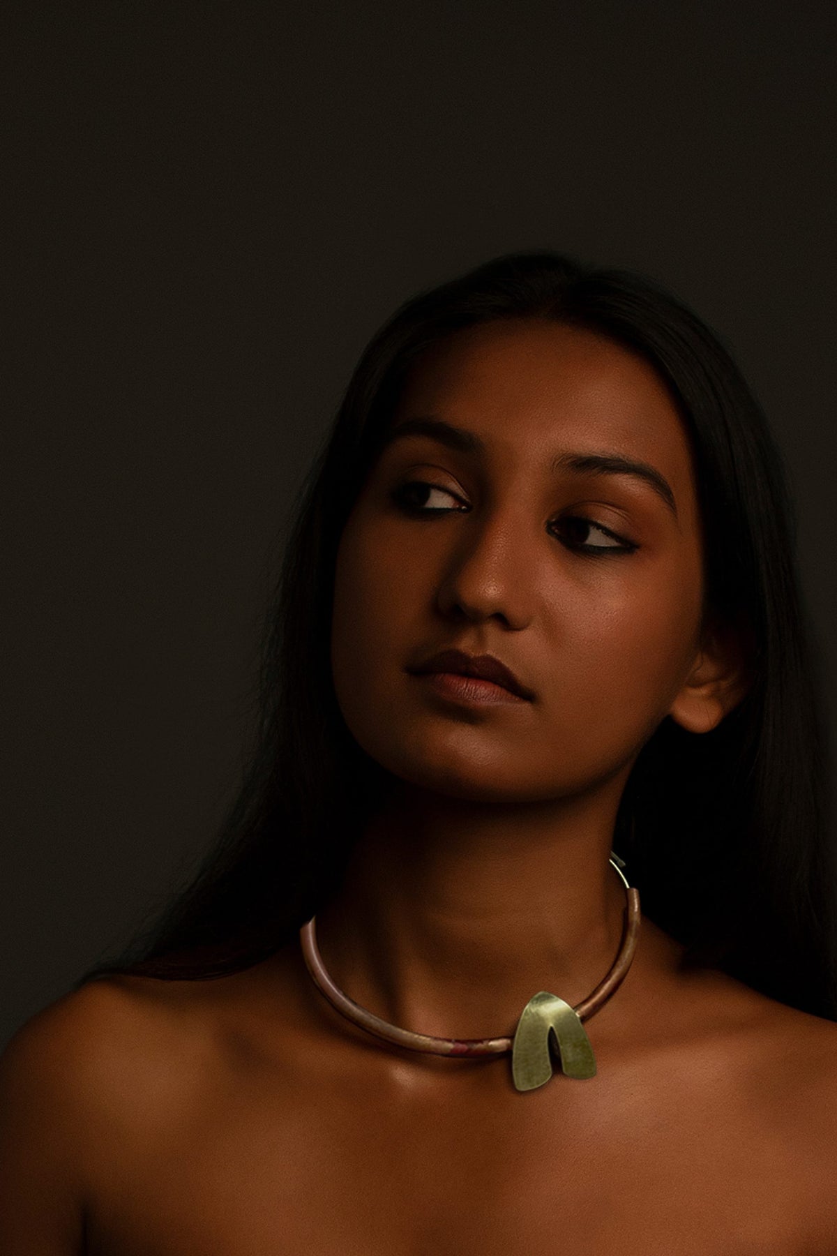 Dookdi Hang-on Torque side view handcrafted brass sculptural artisan jewellery