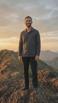 Handwoven kala cotton shirt designed with subtle embroidery, offering texture and everyday comfort.
