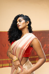 A luxurious rose gold handwoven tissue saree