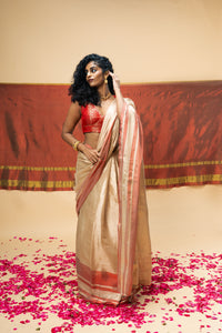 A luxurious rose gold handwoven tissue saree