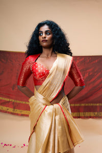 A luxurious rose gold handwoven tissue saree